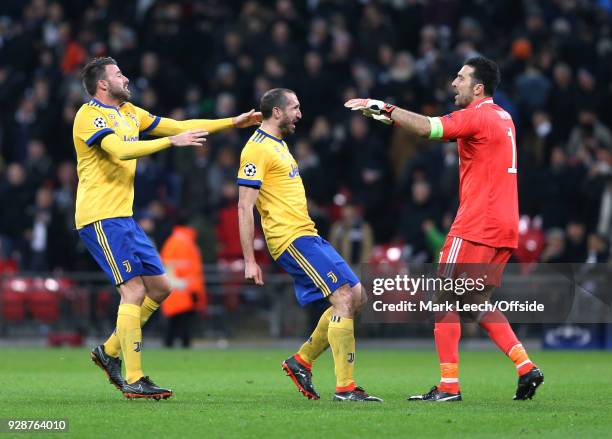 Celebration time for Juventus defenders Andreas Barzagli, Giorgio Chiellini and goalkeeper Gianluigi Buffon during the UEFA Champions League Round of...