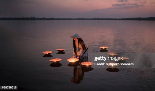 vietnamese people in ao dai vietnam traditional dress on the lake - sa pa stock pictures, royalty-free photos & images