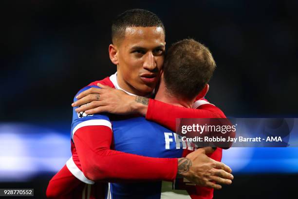 Leo Lacroix of FC Basel and Fabian Frei of FC Basel celebrate at full time during the UEFA Champions League Round of 16 Second Leg match between...