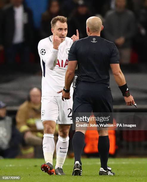 Tottenham Hotspur's Christian Eriksen speaks with referee Szymon Marciniak during the UEFA Champions League round of 16, second leg match at Wembley...