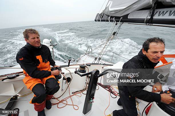 French skippers Marc Guillemot and Charles Caudrelier sail on their monohull "Safran" during a training session off the coast of the western French...