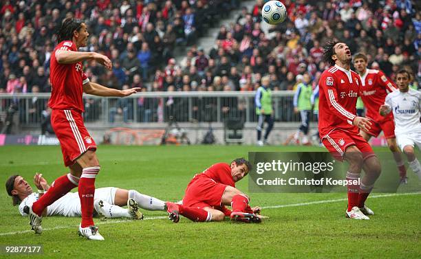 Daniel van Buyten of Bayern Muenchen scores the opening goal during the Bundesliga match between FC Bayern Muenchen and FC Schalke 04 at Allianz...