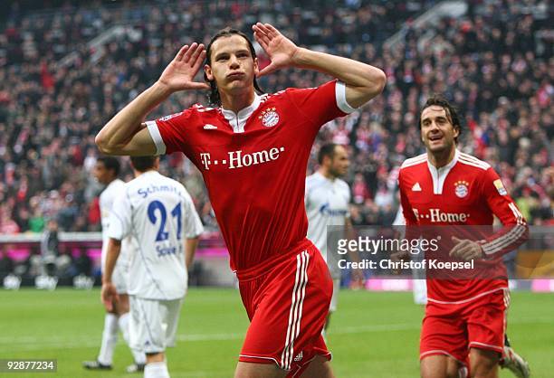 Daniel van Buyten of Bayern Muenchen celebrates after scoring the opening goal during the Bundesliga match between FC Bayern Muenchen and FC Schalke...