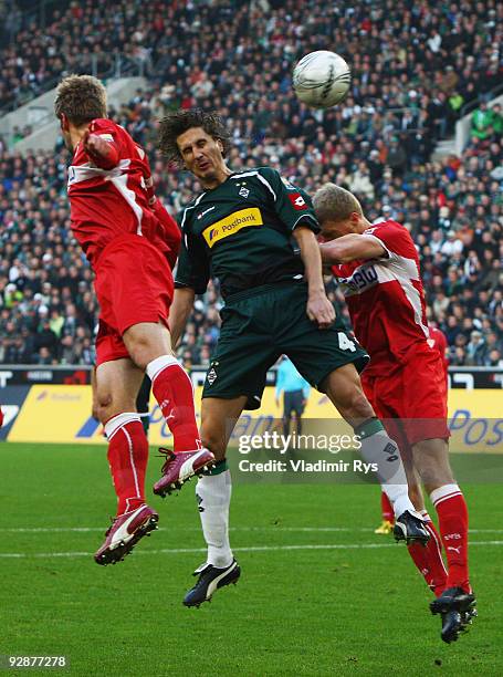 Roel Brouwers of Gladbach, Thomas Hitzlsperger and his team mate Pavel Pogrebnyak of Stuttgart vie for a header during the Bundesliga match between...