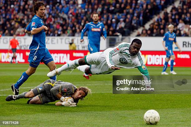 Grafite of Wolfsburg is challenged by goalkeeper Timo Hildebrand and Christian Eichner of Hoffenheim during the Bundesliga match between 1899...