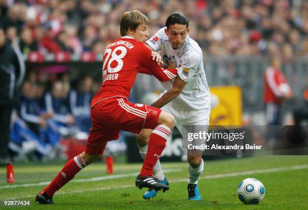 Holger Badstuber of Bayern Muenchen fights for the ball with Kevin Kuranyi of Schalke 04 during the German Bundesliga football match at Allianz Arena...