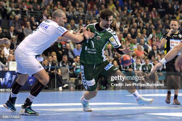 Zeljko Musa of SC Magdeburg and Fabian Wiede of Fuechse Berlin during the DHB Cup quarterfinal game between Fuechse Berlin and SC Magdeburg at...