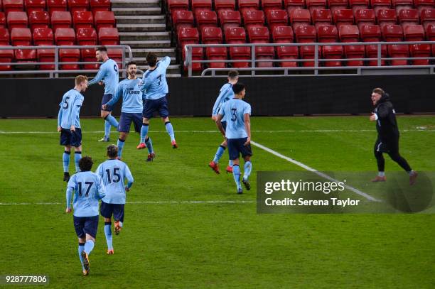 Newcastle players celebrate after they win the match after a penalty shoot out during the Premier League International Cup between Sunderland and...