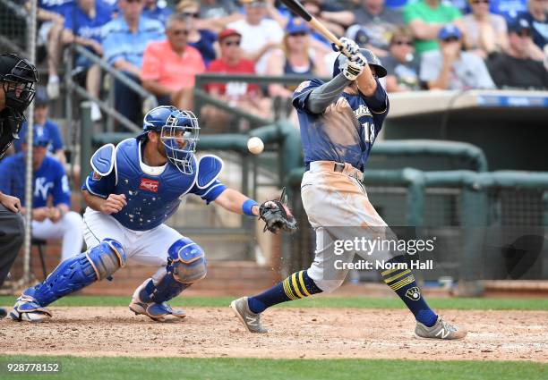 Drew Butera of the Kansas City Royals cannot come up with a foul ball hit by Eric Sogard of the Milwaukee Brewers during the fifth inning of a spring...