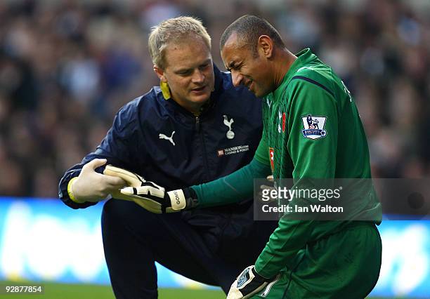 Heurelho Gomes of Tottenham Hotspur winces in pain during the Barclays Premier League match between Tottenham Hotspur and Sunderland at White Hart...
