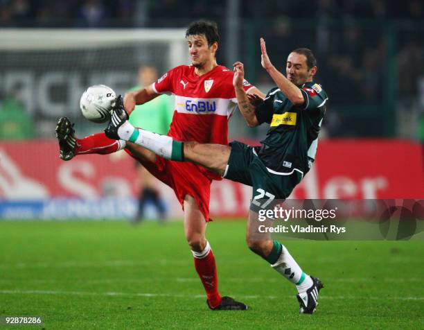 Oliver Neuville of Gladbach and Zdravko Kuzmanovic of Stuttgart battle for the ball during the Bundesliga match between Borussia Moenchengladbach and...