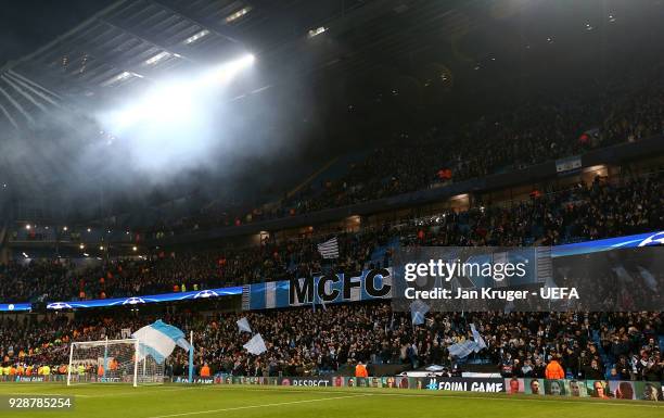 Manchester City fans hold up a banner during the UEFA Champions League Round of 16 Second Leg match between Manchester City and FC Basel at Etihad...