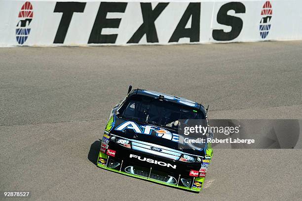 Carl Edwards drives the Aflac Ford during practice for the NASCAR Sprint Cup Series Dickies 500 at Texas Motor Speedway on November 7, 2009 in Fort...