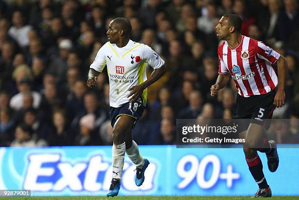 Jermain Defoe of Tottenham Hotspur and Anton Ferdinand of Sunderland during the Barclays Premier League match between Tottenham Hotspur and...