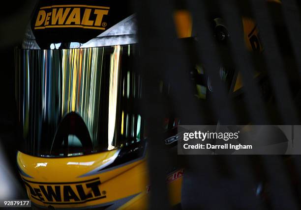 Matt Kenseth, driver of the Dewalt Ford, sits in his car during practice for the NASCAR Sprint Cup Series Dickies 500 at Texas Motor Speedway on...