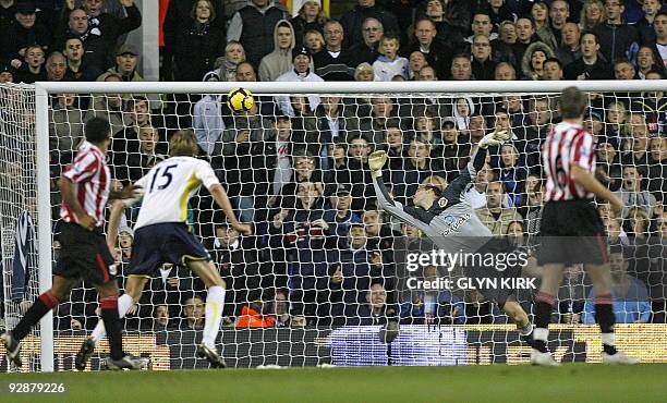 Sunderland's Hungarian goalkeeper Marton Fulop fails to stop Tottenham's English defender Tom Huddlestone scoring the second goal during the English...