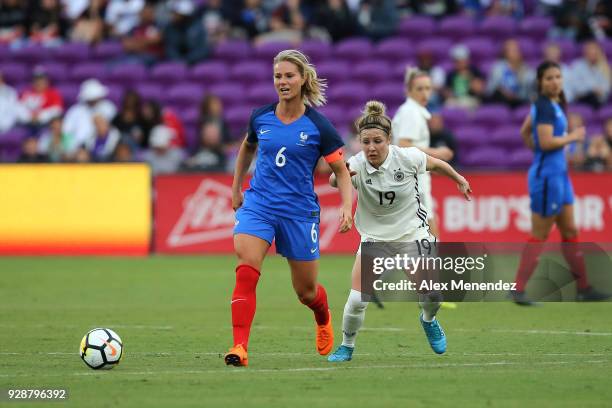 Amandine Henry of France and Svenja Huth of Germany watch the ball during the SheBelieves Cup soccer match at Orlando City Stadium on March 7, 2018...