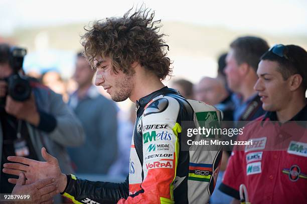 Marco Simoncelli of Italy and Metis Gilera celebrates the second place on the grid after the qualifying practice session ahead of the MotoGP Of...