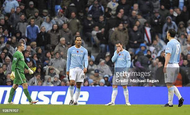 Shay Given, Joleon Lescott, Wayne Bridge and Gareth Barry of Manchester City look dejected after a Burnley goal during the Barclays Premier League...