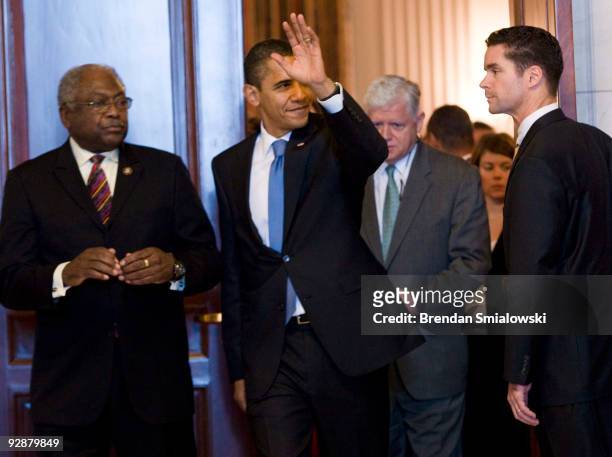 President Barack Obama waves while leaving after a Democratic Caucus meeting on Capitol Hill November 7, 2009 in Washington, DC. US President Barack...