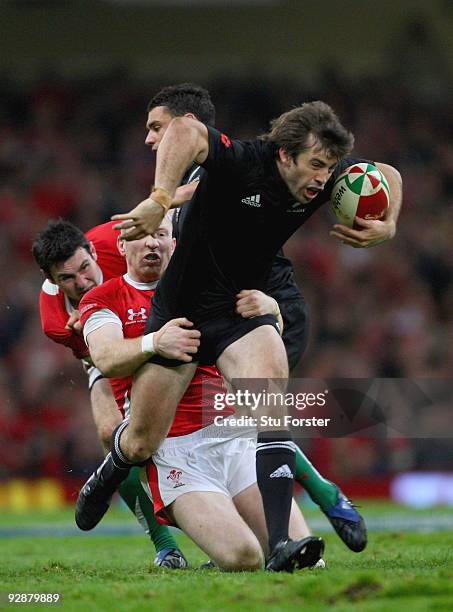 Wales player Tom Shanklin tackles All Blacks centre Conrad Smith during the Invesco Perpetual series match between Wales and New Zealand at...