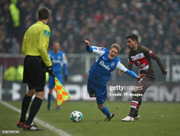 Johannes van den Bergh of Holstein Kiel and Sami Allagui of St. Pauli battle for the ball during the Second Bundesliga match between FC St. Pauli and...