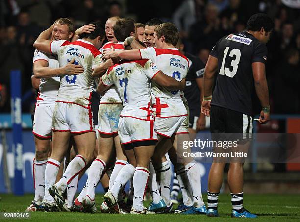 The England team celebrate the try of Peter Fox during the Gillette Four Nations match between England and New Zealand at Galpharm Stadium on...