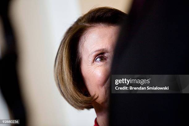 Speaker of the House Nancy Pelosi listens while meeting with press after a caucus meeting with President Barack Obama on Capitol Hill November 7,...