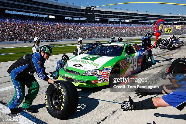 Casey Mears, driver of the Holiday Inn/Holiday Inn Express Chevrolet, pits during the NASCAR Nationwide Series O'Reilly Challenge at Texas Motor...