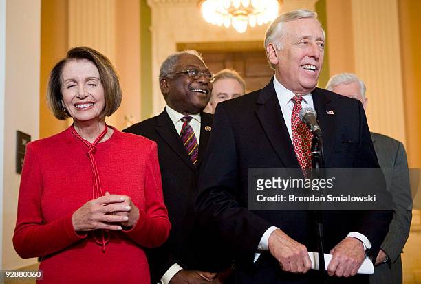 Speaker of the House Nancy Pelosi , House Majority Whip James Clyburn and House Majority Leader Steny Hoyer laugh while speaking to the press after a...