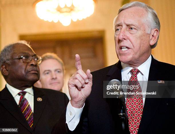 House Majority Whip James Clyburn and Rep. Chris Van Hollen listen while House Majority Leader Steny Hoyer speak to the press after a caucus meeting...
