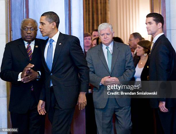 House Majority Whip James Clyburn , President Barack Obama , Rep. John Larson leave after a caucus meeting on Capitol Hill November 7, 2009 in...