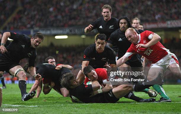 Wales winger Shane Williams tackles all blacks Conrad Smith to deny him a try during the Invesco Perpetual series match between Wales and New Zealand...