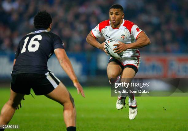 Kyle Eastmond of England jumps with the ball during the Gillette Four Nations match between England and New Zealand at The Galpharm Stadium on...