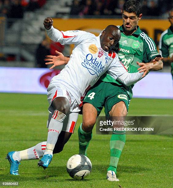 Nancy's Issiar Dia vies with Saint-Etienne's Efsthios Tavlaridis during the French L1 football match Nancy vs Saint-Etienne on November 7, 2009 at...