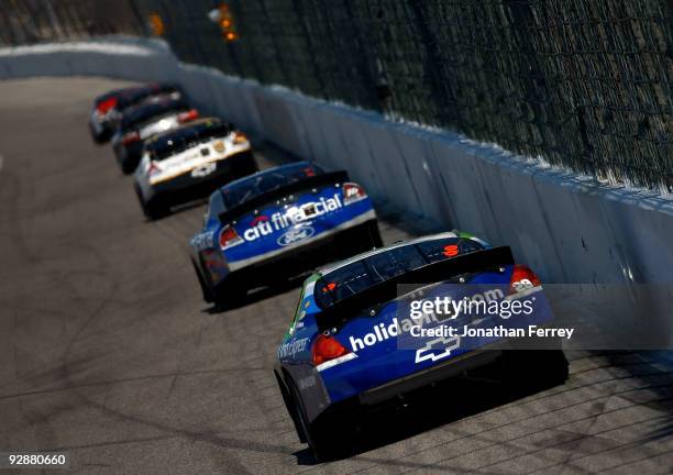 Casey Mears, driver of the Holiday Inn/Holiday Inn Express Chevrolet, drives behind a group of cars during the NASCAR Nationwide Series O'Reilly...