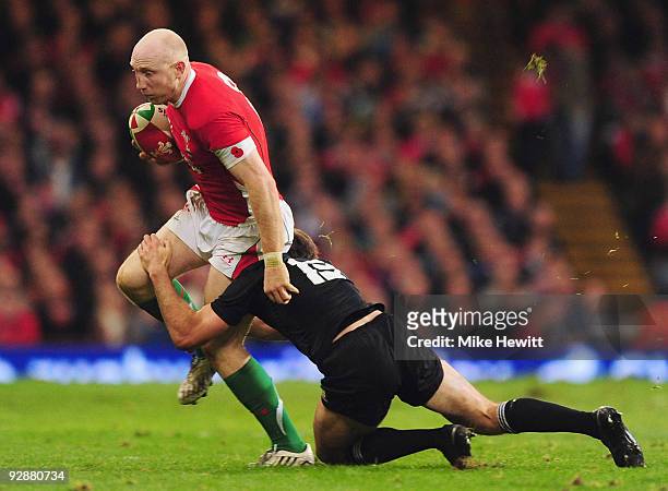 Tom Shanklin of Wales is stopped by Conrad Smith of New Zealand during the Invesco Perpetual Series match between Wales and New Zealand at Millennium...