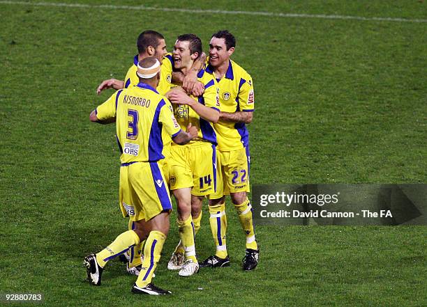 Jonathan Howson of Leeds celebrates with Andy Hughes , Patrick Kisnorbo and Bradley Johnson after scoring their first goal with during the FA Cup...