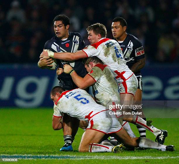 Kieran Foran of New Zeland is challenged by England side during the Gillette Four Nations match between England and New Zealand at The Galpharm...