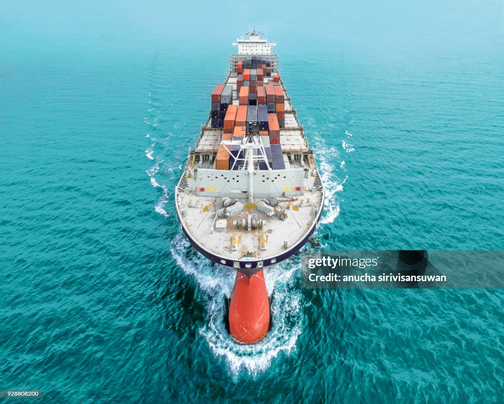 Aerial view of cargo ship, cargo container in warehouse harbor at thailand .