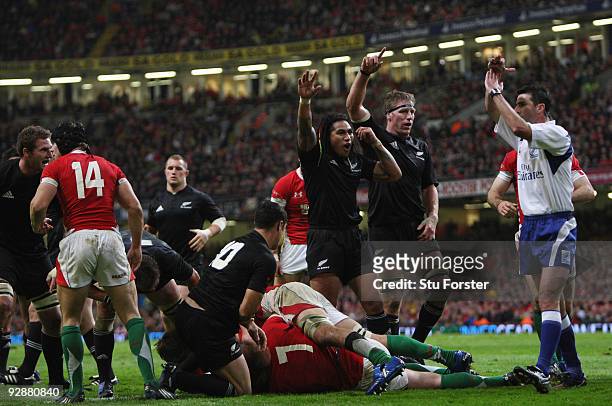 The All Blacks claim a try after Wales winger Shane Williams had tackled all blacks Conrad Smith to deny him a try during the Invesco Perpetual...