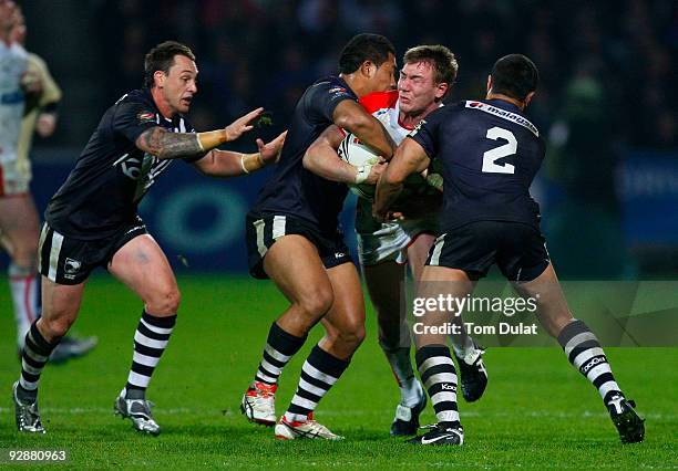 Michael Shenton of England is tackled during the Gillette Four Nations match between England and New Zealand at The Galpharm Stadium on November 07,...