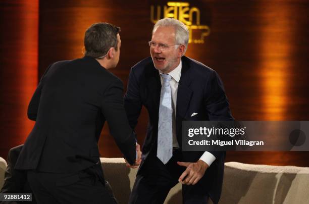 Singer Robbie Williams greets entertainer Harald Schmidt during the 'Wetten dass...?' show at the Volkswagenhalle on November 7, 2009 in...