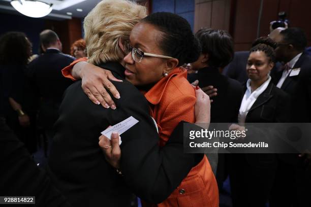 Kim Bose , mother of murdered Hampton University student Joseph Bose, is embraced by Sen. Debbie Stabenow follow meeting with U.S. Senate Democrats...