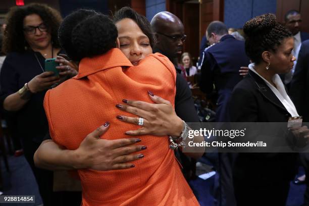 Tammi Ramzziddin , widow of Prince GeorgeÕs County Police Cpl. Mujahid Ramzziddin, embraces Kim Bose, mother of murdered Hampton University student...