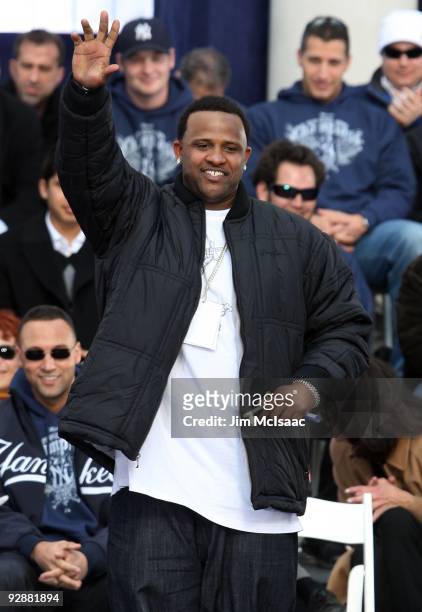 Sabathia of the New York Yankees waves to the crowd after accepting his key to the city at the New York Yankees World Series Victory Celebration at...