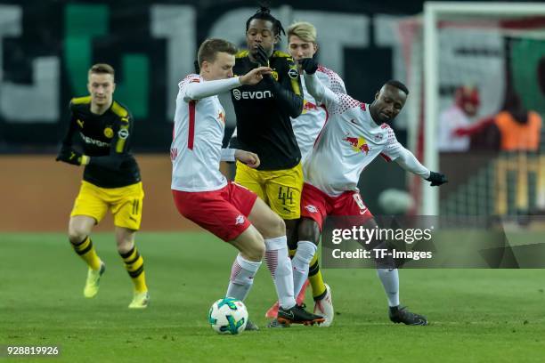 Marcel Sabitzer of Leipzig, Ademola Lookman of Leipzig and Michy Batshuayi of Dortmund battle for the ball during the Bundesliga match between RB...