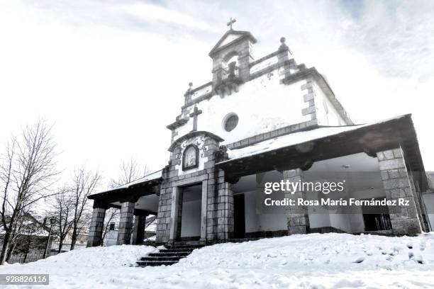 front facade nuestra sra. del rosario church after a day of snowfall, valsain, san ildefonso, segovia, spain, europe. - madonna del rosario stock pictures, royalty-free photos & images