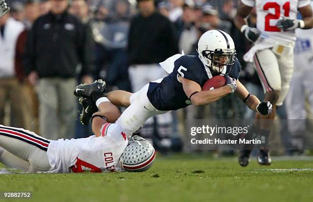 Wide receiver Graham Zug of the Penn State Nittany Lions is tackled by cornerback Kurt Coleman of the Ohio State Buckeyes during a game on November...