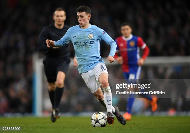 Phil Foden of Manchester City runs with the ball during the UEFA Champions League Round of 16 Second Leg match between Manchester City and FC Basel...